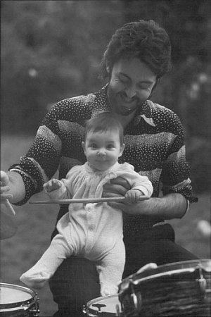 Paul plays Ringo's drums at home with his daughter Mary.